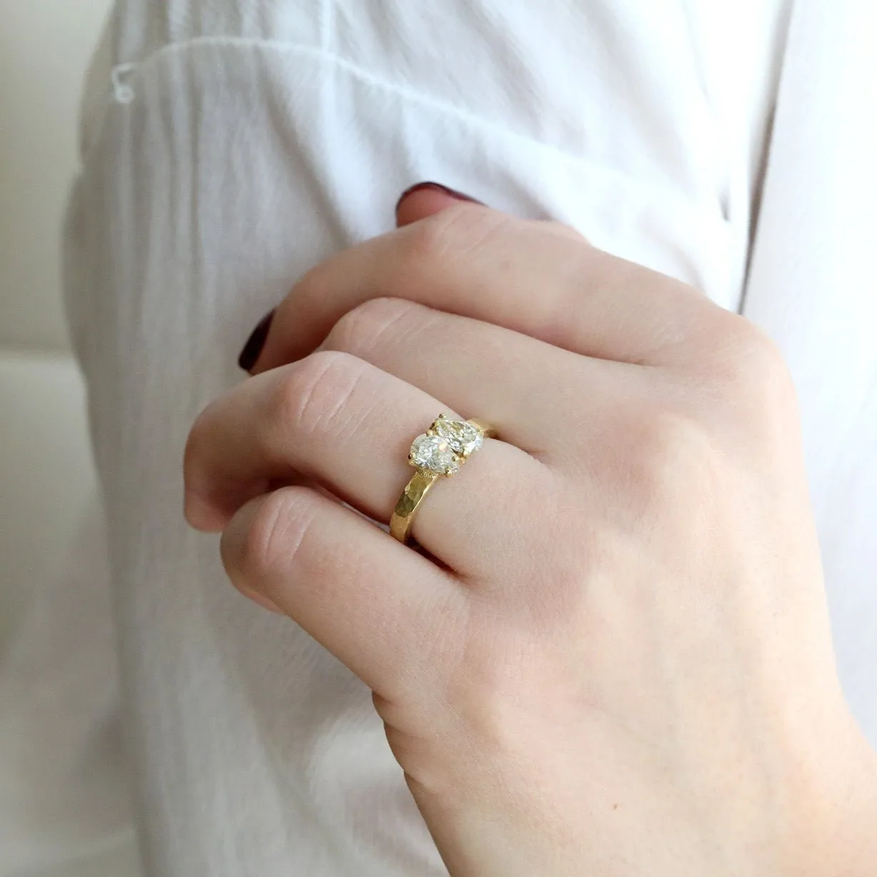 18 Karat Yellow Gold Hammered Band with Two Pear Shaped Diamonds
