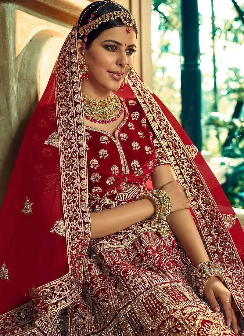Maroon And Gold Heavy Embroidered Velvet Lehenga Choli