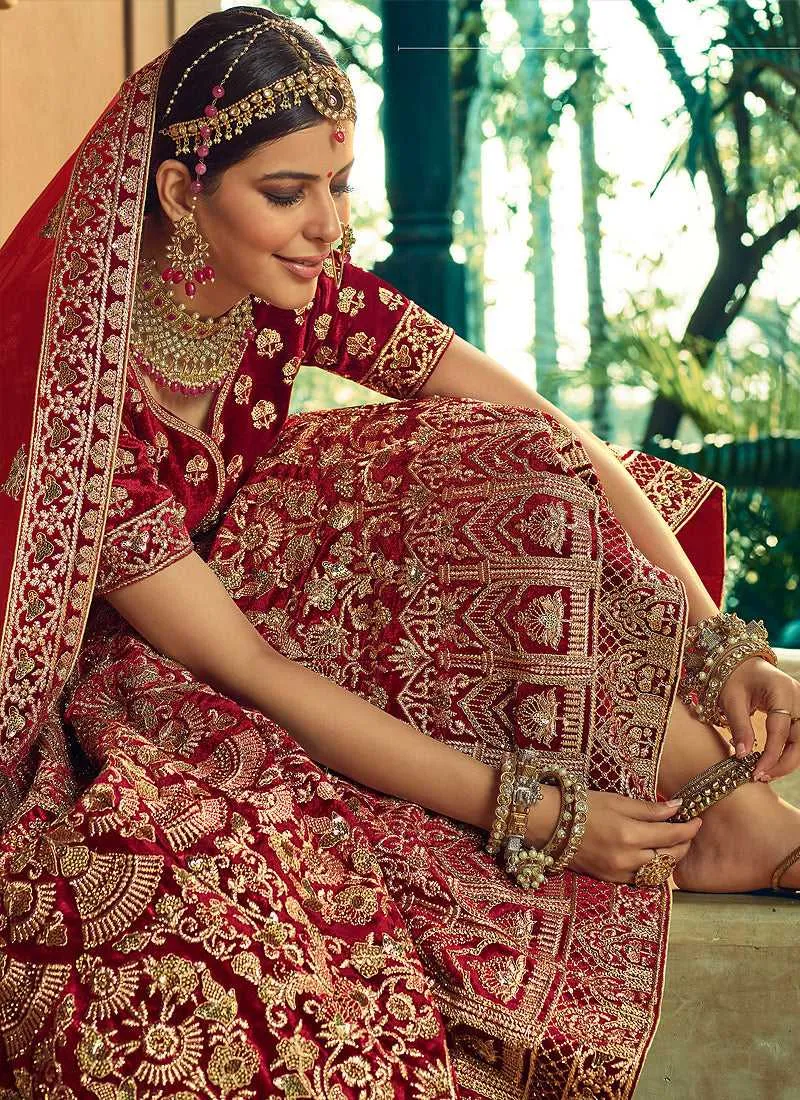 Maroon And Gold Heavy Embroidered Velvet Lehenga Choli