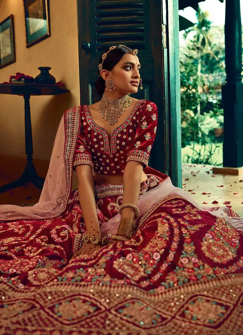 Maroon And Gold Heavy Embroidered Velvet Lehenga Choli