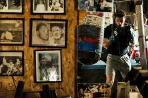 Sully's Gym, Toronto, Ontario, [man training, with wall of photos]